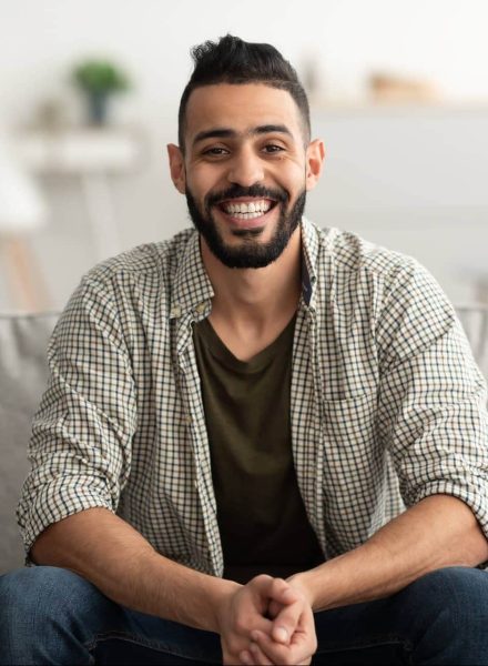 portrait-of-handsome-young-arab-man-smiling-and-lo-2021-12-09-19-23-26-utc-e1660364814992.jpg